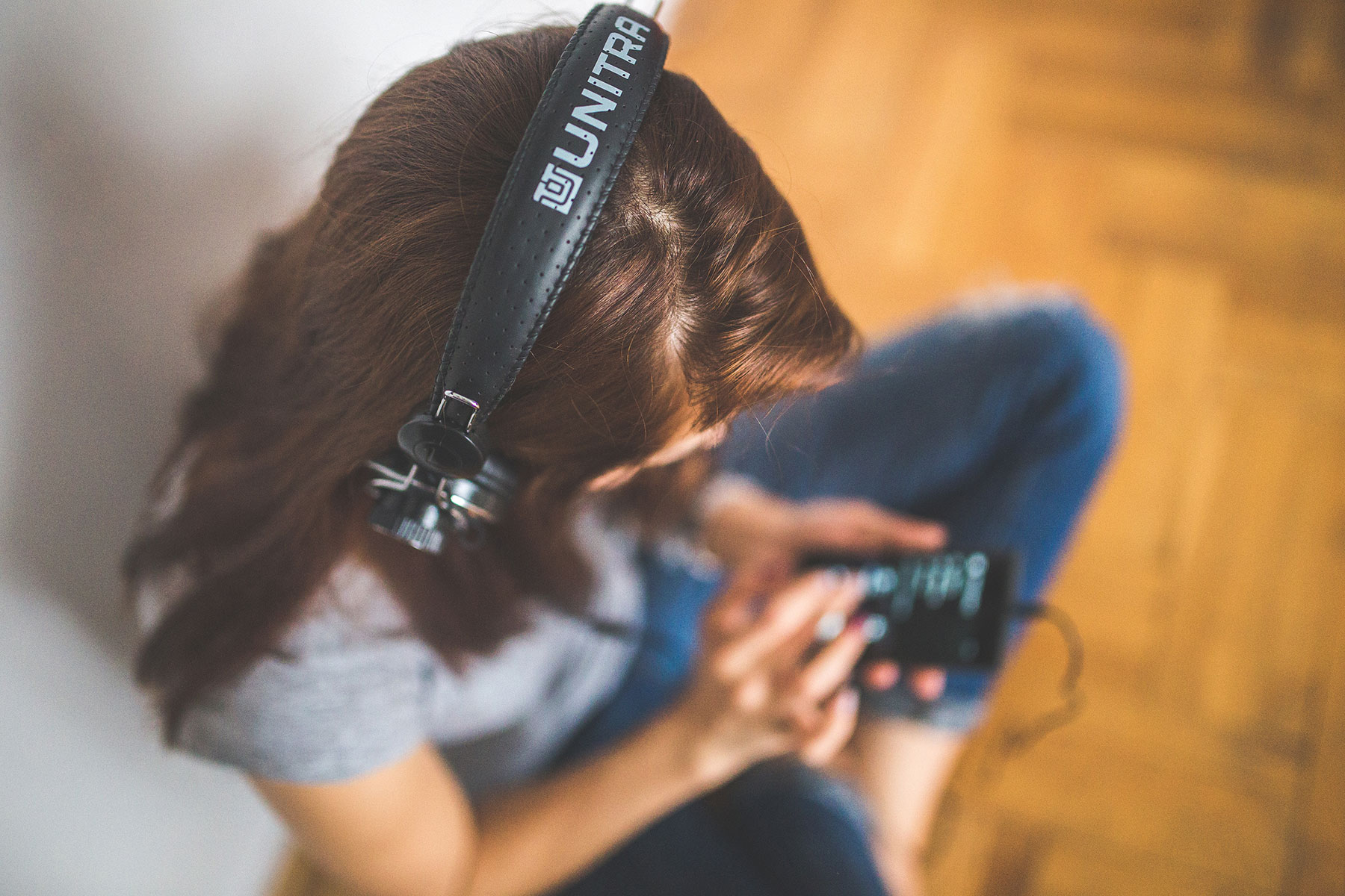 Woman with headphones and smartphone